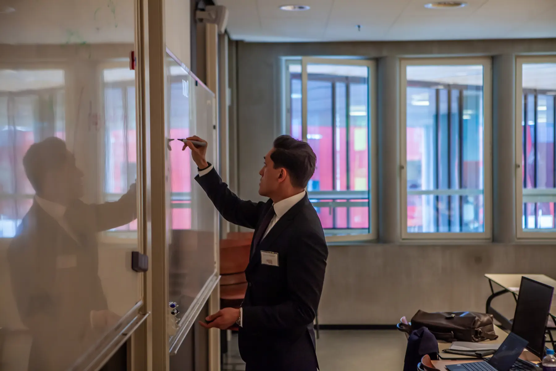 David&nbsp;C.&nbsp;van&nbsp;der&nbsp;Griend writing on a whiteboard during a class
