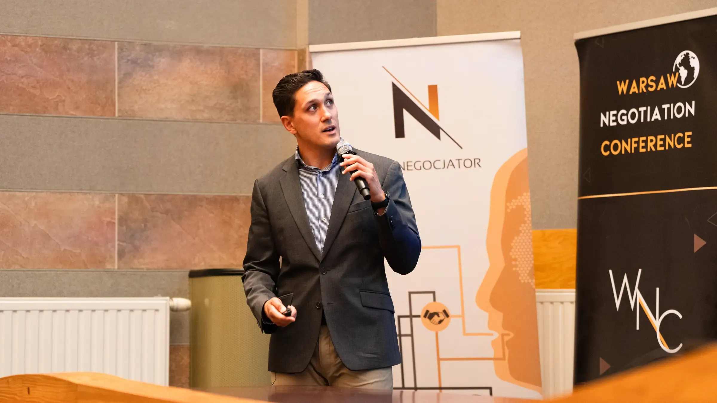 David&nbsp;C.&nbsp;van&nbsp;der&nbsp;Griend speaking with a microphone at the Warsaw Negotiation Conference 2026